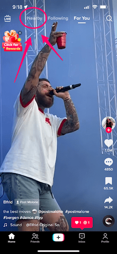 A phone screen showing the TikTok app opened up, wit the option the select "Nearby" in the upper left hand side 